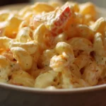 Delicious macaroni salad served in a bowl with fresh vegetables
