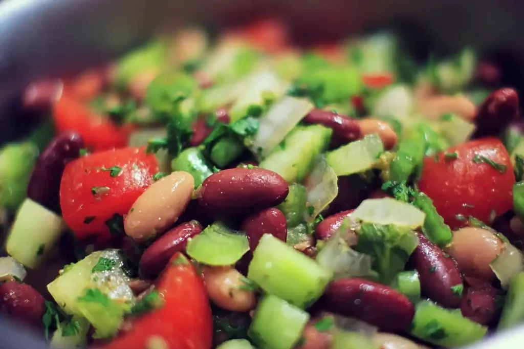 Colorful and nutritious bean salad with fresh vegetables and dressing