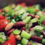 Colorful and nutritious bean salad with fresh vegetables and dressing