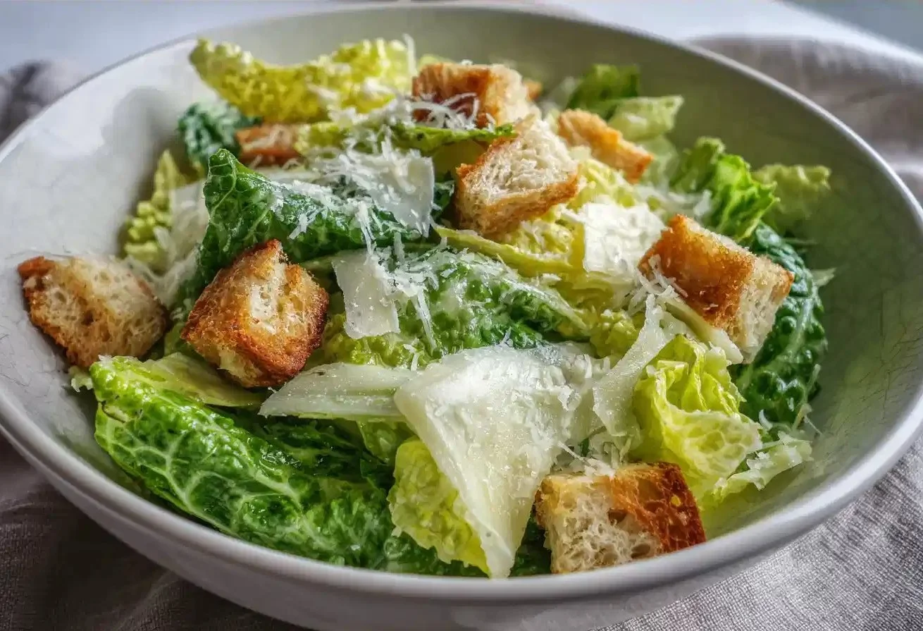 Fresh Caesar Salad with romaine lettuce, croutons, and Caesar dressing