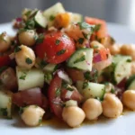 Fresh chickpea salad with vegetables and dressing