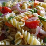 Colorful Italian pasta salad with fresh vegetables and dressing