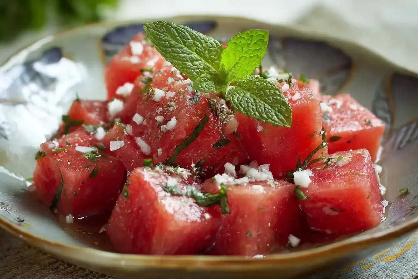 Fresh Watermelon Salad with mint and feta cheese on a plate